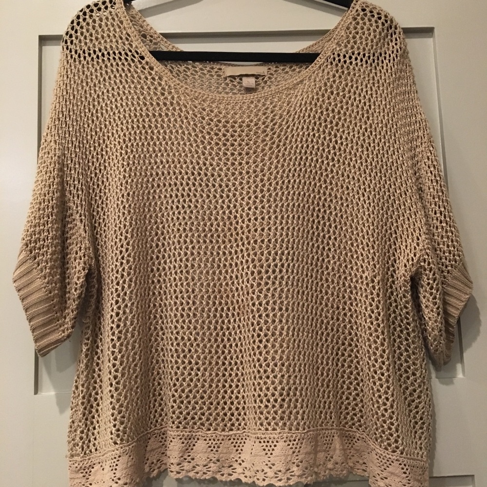 Crochet sweater with lace hem.